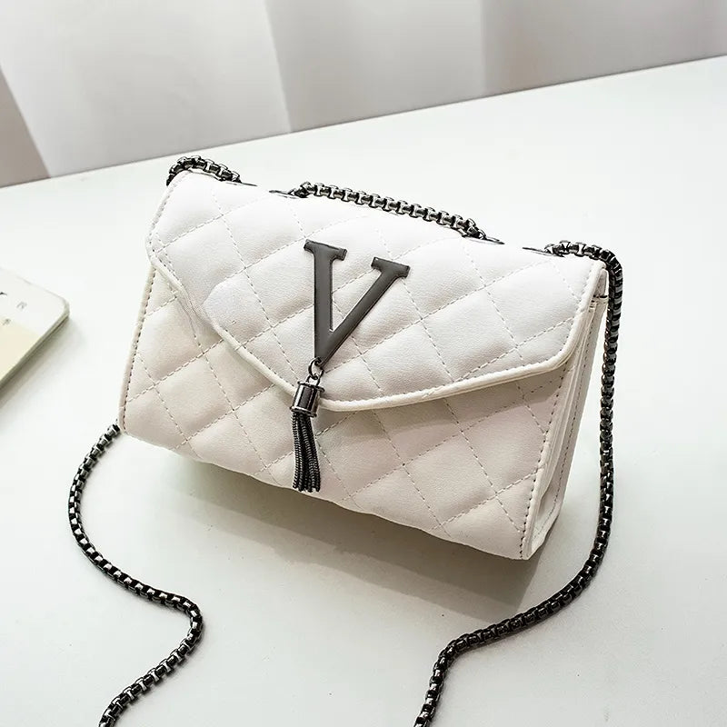 SUNA Viora - Elegant sort quiltet crossbodytas til den moderne kvinde Hvid